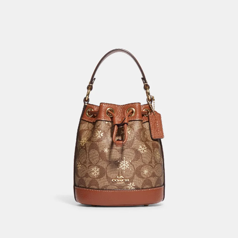 Coach Outlet Dempsey Drawstring Bucket Bag 15 In Signature Canvas With Snowflake Print